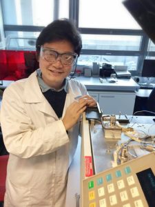 Huian_Liu_in_lab_with_GC_instrument